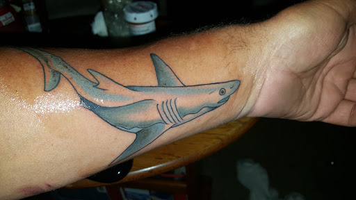 Explore traditional neck tattoo ideas, creative tattoo ideas in Portsmouth, available at Inflicting Ink, LLC