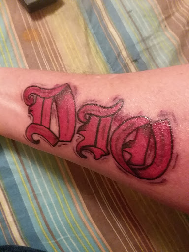 Explore last name tattoo ideas on arm, creative tattoo ideas in Anniston, available at Wicked Game Tattoo & Piercing Studio