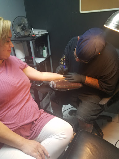 Explore guy hand tattoo ideas, creative tattoo ideas in Orange Park, available at All Aces Tattoo and Body Piercing LLC