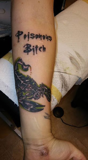 Find cardinal tattoo ideas for ladies for your next unique tattoo in Cumberland at Queen City Ink