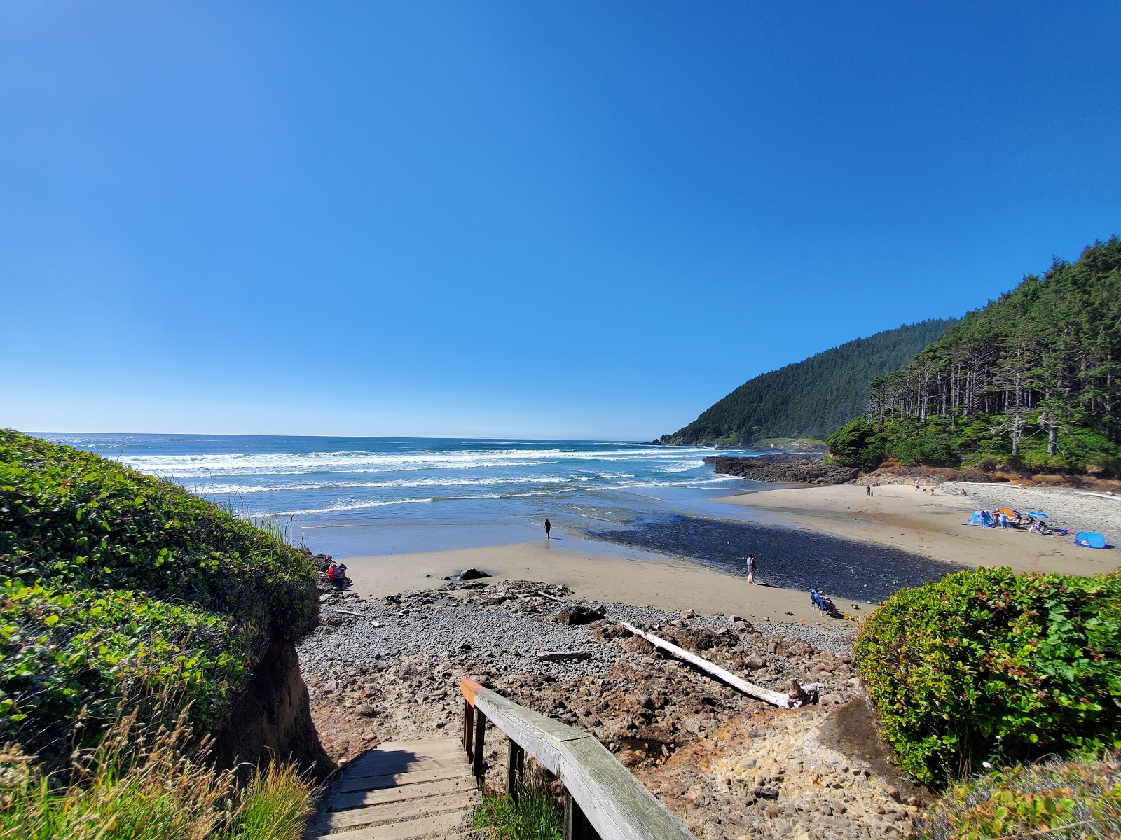 Foto von Neptune Beach mit beiger sand Oberfläche