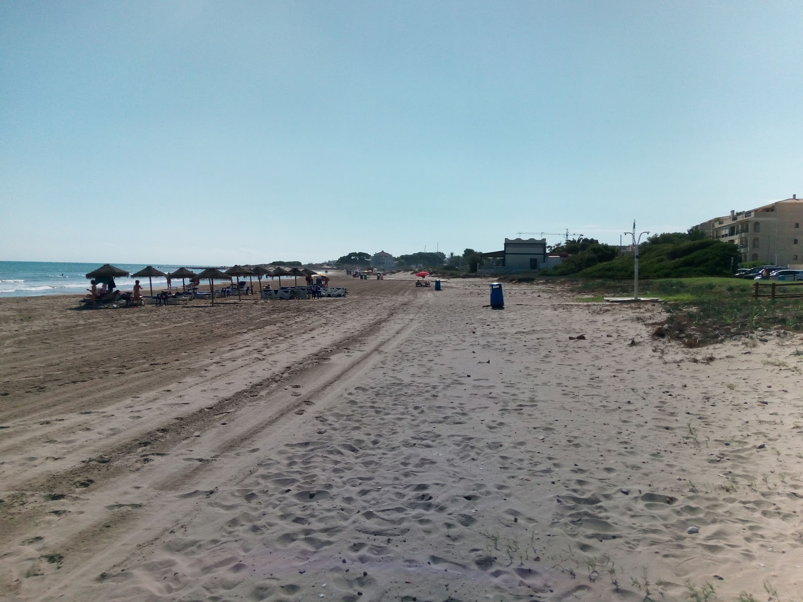Foto van Playa del Cargador met bruin zand oppervlakte