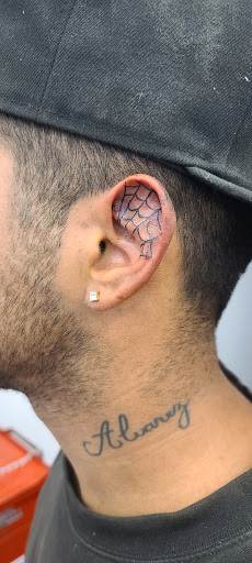 Explore cover up tattoo ideas lower back, creative tattoo ideas in Lewiston, available at Walkins tattoos studio