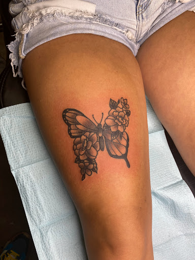 Explore black hole tattoo ideas, creative tattoo ideas in Paducah, available at Knuckle Up Tattoo Co.