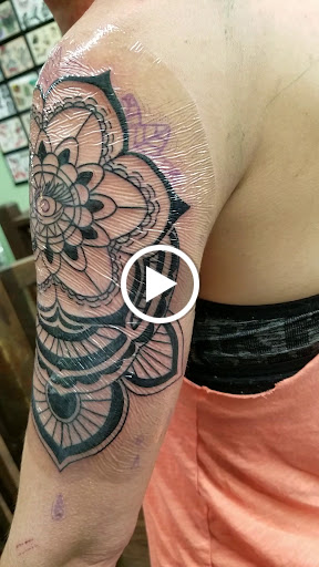 Explore hand tattoo drawing ideas, creative tattoo ideas in Orange, available at Leftys Tattoo