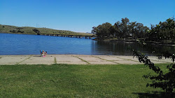 Foto von Playa De Los Calicantos und die siedlung