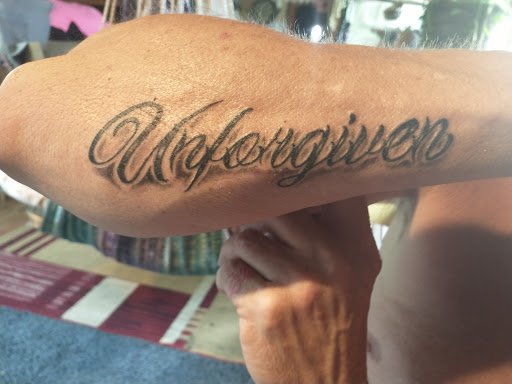 Explore tattoo book ideas, creative tattoo ideas in Watertown, available at Wonderland Ink Factory Tattoos and Piercing