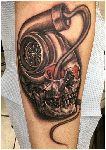Explore front thigh tattoo ideas, creative tattoo ideas in Chicago, available at Royal Flesh Tattoo and Piercing