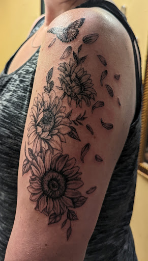 Explore cover up arm tattoo ideas, creative tattoo ideas in Wylie, available at Scarecrow Galleries Tattoo Company