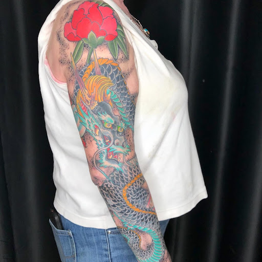 Explore wedding ring tattoo ideas for men, creative tattoo ideas in Delaware, available at Rose & Web Tattoo