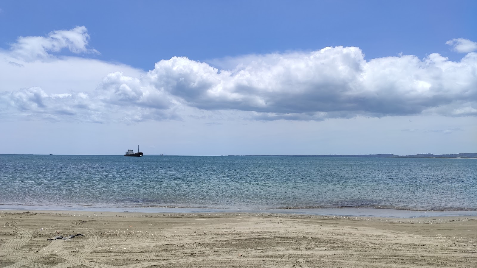 Foto av Wailoaloa Beach med turkosa vatten yta