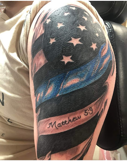 Explore laos tattoo ideas, creative tattoo ideas in Jasper, available at Addictive Ink tattoo and piercing studio