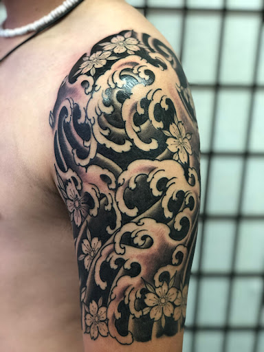 Explore rib cage tattoo ideas for guys, creative tattoo ideas in Honolulu, available at Sacred Art Tattoo Waikiki