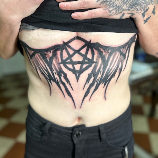 Explore large tattoo cover up ideas, creative tattoo ideas in Lima, available at Legacy Ink Tattoo