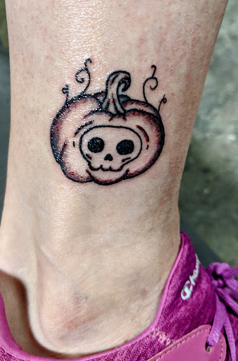 Explore cool hand tattoo ideas, creative tattoo ideas in Wilmington, available at Wildcard Studios