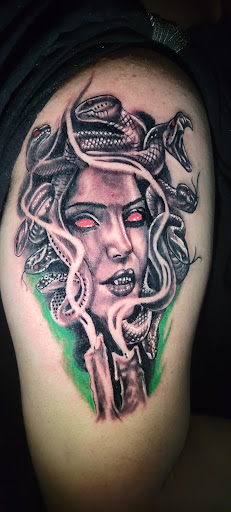 Explore garter tattoo ideas, creative tattoo ideas in Angola, available at Hoodlum Ink