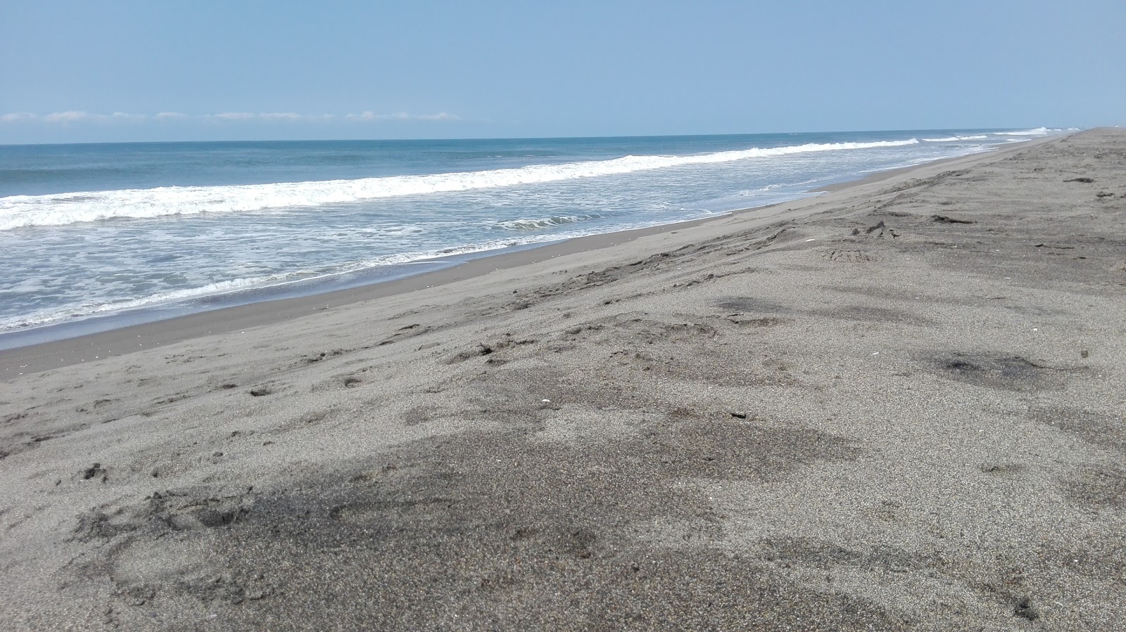 Foto av San Simon beach med blå rent vatten yta