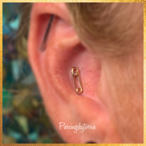 Explore female tattoo ideas for lower back, creative tattoo ideas in Fort Walton Beach, available at Piercings by Torrie