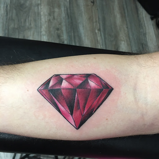 Explore heart and rose tattoo ideas, creative tattoo ideas in Frisco, available at Frisco Tattoo Company - Steel PaintBrush