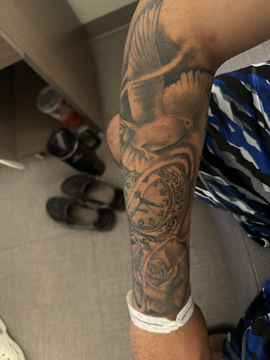 Explore rose thigh tattoo ideas, creative tattoo ideas in Midland, available at Good Faith Tattoo Studio