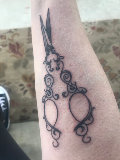 Explore small dragon tattoo ideas, creative tattoo ideas in Elkview, available at Andy Electric Tattoos