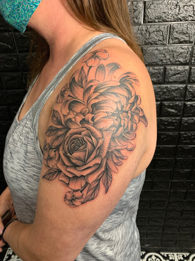 Find camping tattoo ideas for your next unique tattoo in Kenosha at Kenosha Tattoo Company