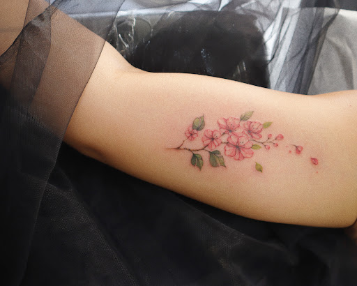 Explore head tattoo ideas for females, creative tattoo ideas in Orange, available at Baron Art Tattoo