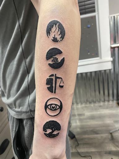 Explore tattoo ideas guns, creative tattoo ideas in Allegan, available at Doghouse Crue Tattoos