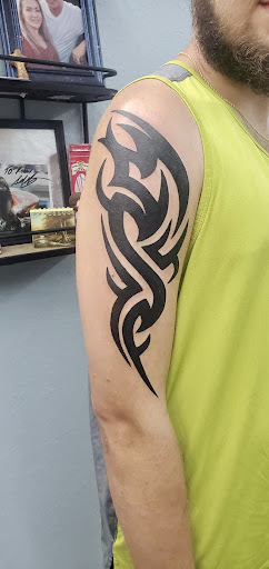 Explore rose hand tattoo ideas, creative tattoo ideas in Ocala, available at Beauty in a Canvas Tattoo and Art Gallery