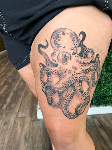 Explore lion cub tattoo ideas, creative tattoo ideas in Batavia, available at The Pretty Pin-Up Tattoo Parlor