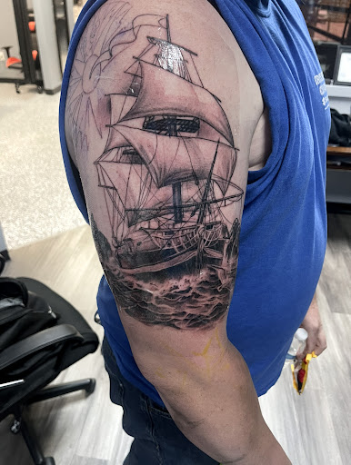 Find angel hand tattoo ideas for your next unique tattoo in Monroe at Skin City Tattoo Studio