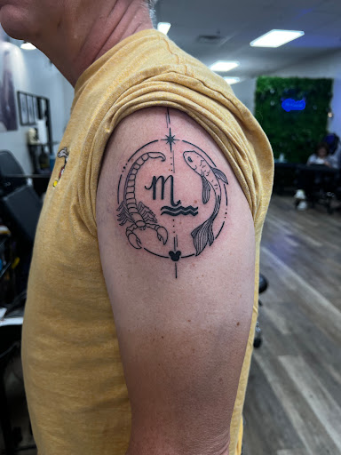 Explore wall-e tattoo ideas, creative tattoo ideas in Ocoee, available at Fine Ink Studios Tattoos