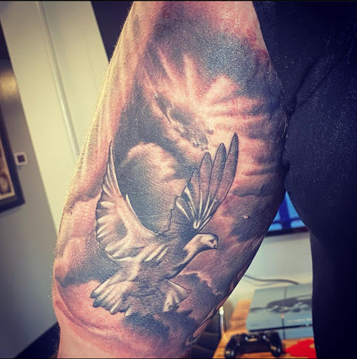 Explore tribal cross tattoo ideas, creative tattoo ideas in Rockford, available at Euro Tattoo