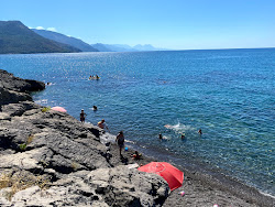 Perla beach'in fotoğrafı düz bir kıyı şeridi ile birlikte