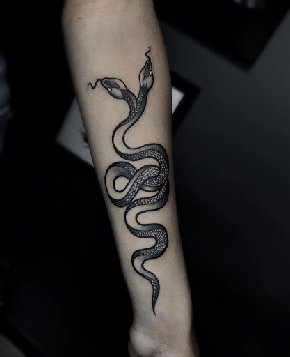 Explore tombstone movie tattoo ideas, creative tattoo ideas in Corona, available at Crop Circles Tattoo Studio