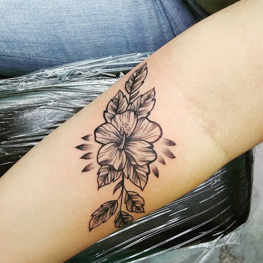 Find feminine skull tattoos ideas for your next unique tattoo in Calhoun at A Sailors Grave Tattoo Parlor