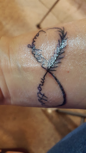 Explore mountain bike tattoo ideas, creative tattoo ideas in Dover, available at Walls of Wonder Tattoo And Body Piercing