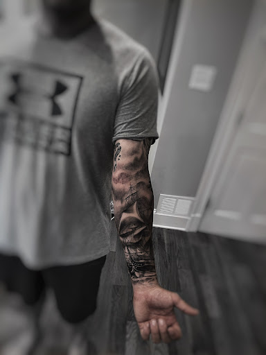 Explore black and gray tattoo sleeve ideas, creative tattoo ideas in Lavonia, available at 1890 Tattoo Co.
