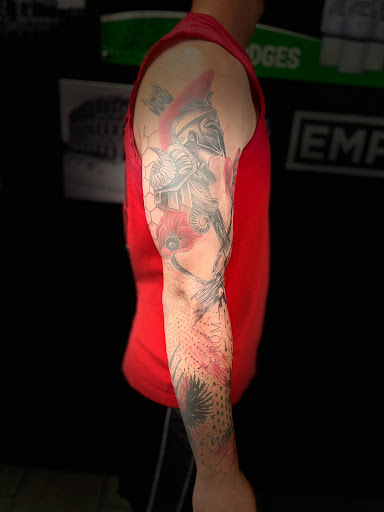 Explore lily tattoo ideas, creative tattoo ideas in Cadillac, available at Limitless Ink Tattoo Studio