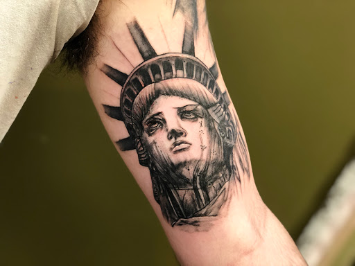 Explore insanity tattoo ideas, creative tattoo ideas in Batavia, available at The Pretty Pin-Up Tattoo Parlor