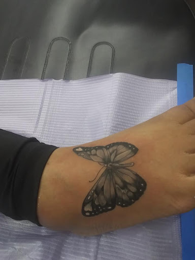 Explore blackout sleeve tattoo ideas, creative tattoo ideas in Elkhart, available at Firefly Art Inclusive