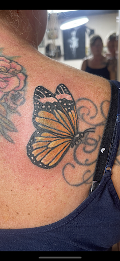 Explore color flower tattoo ideas, creative tattoo ideas in Clintonville, available at Honey Heart Tattoo