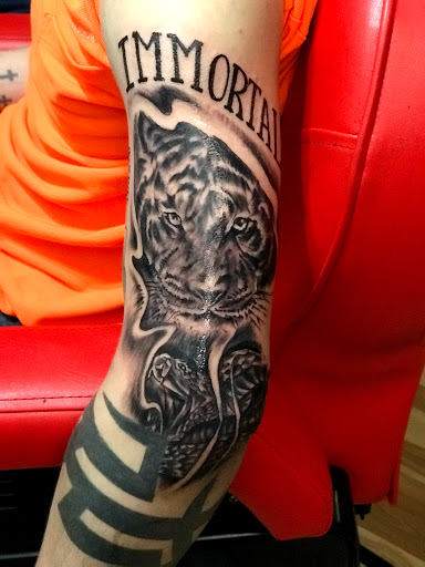 Explore spartan helmet tattoo ideas, creative tattoo ideas in Baytown, available at Big Juniors Tattoos