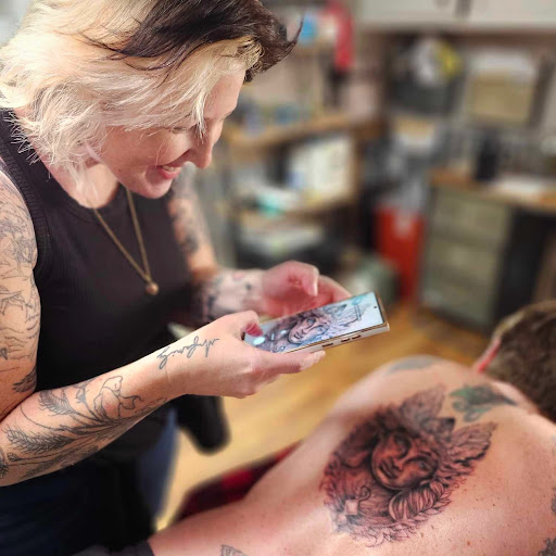 Explore snake sleeve tattoo ideas, creative tattoo ideas in Minocqua, available at Whisky Rose Tattoo Parlor