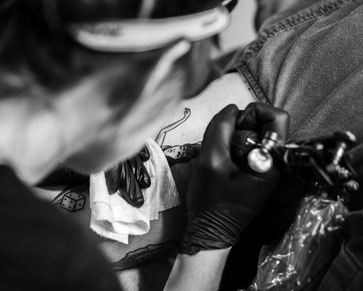 Explore name placement tattoo ideas, creative tattoo ideas in Atlanta, available at Big Cat Tattoo