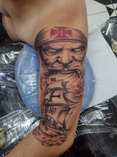Logo da empresa - Planet Tattoo