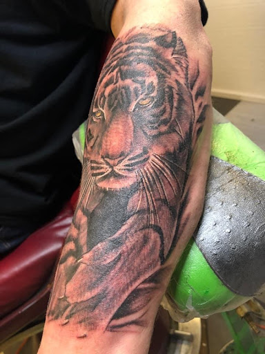 Explore tattoo sleeve black and grey ideas, creative tattoo ideas in Anderson, available at FearlessTattoos and Piercing