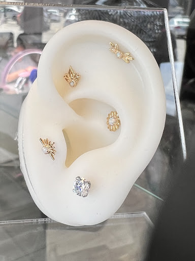 Explore trapezius tattoo ideas, creative tattoo ideas in Milwaukee, available at Beauty is Pain Tattoo and Body Piercings