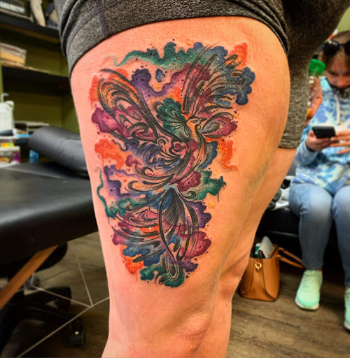 Explore tramp stamp tattoos ideas, creative tattoo ideas in Buffalo, available at Signature Ink