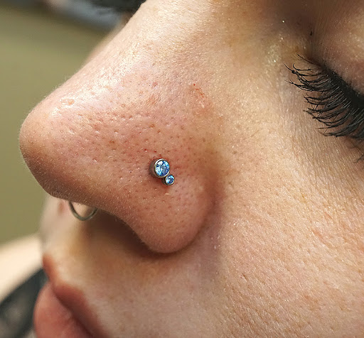 Explore 2 face tattoo ideas, creative tattoo ideas in Tempe, available at Club Tattoo